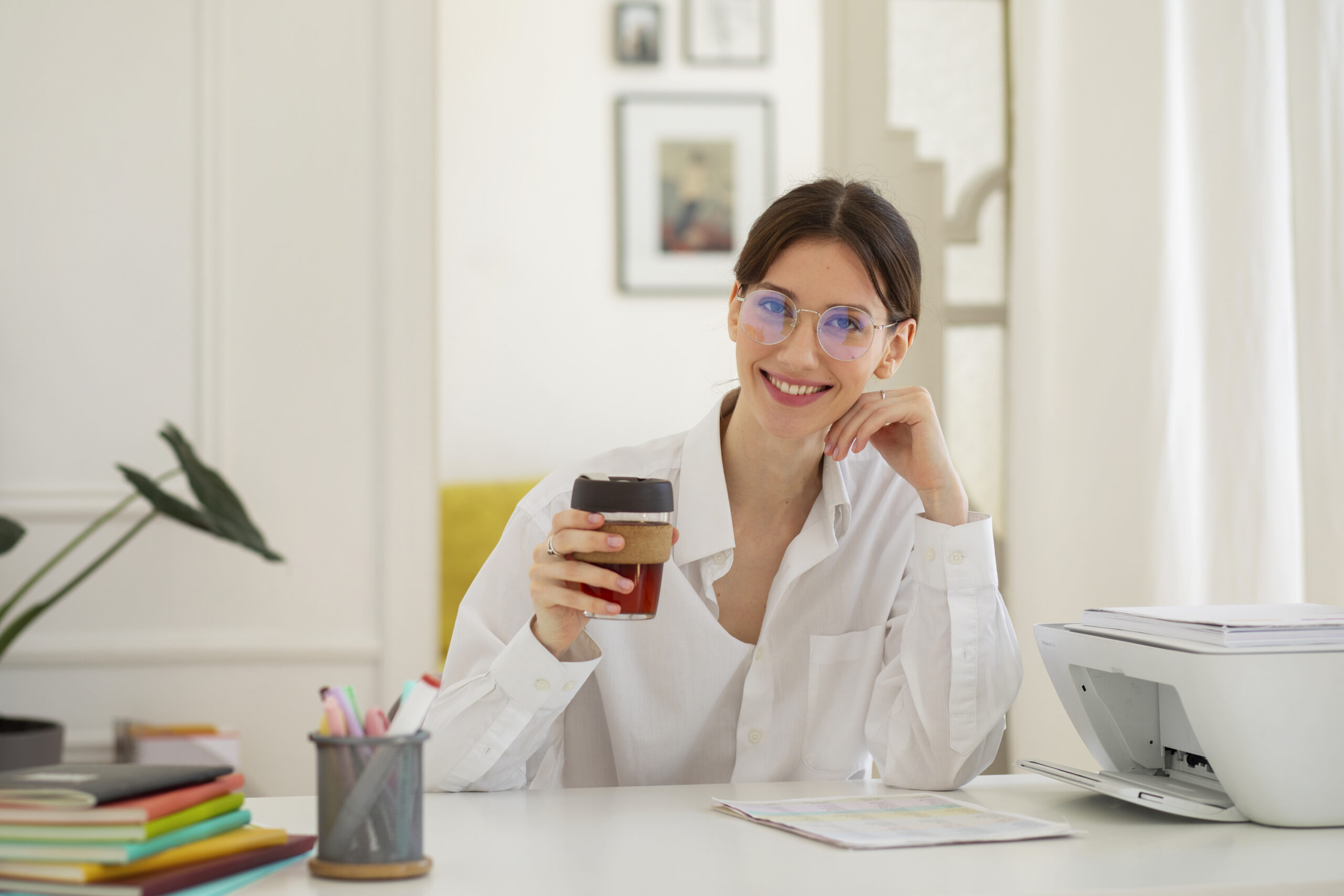 Relaxed user enjoying coffee after resolving printer offline issue